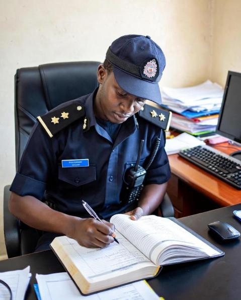 Security officer reviewing camera feeds for incident reporting